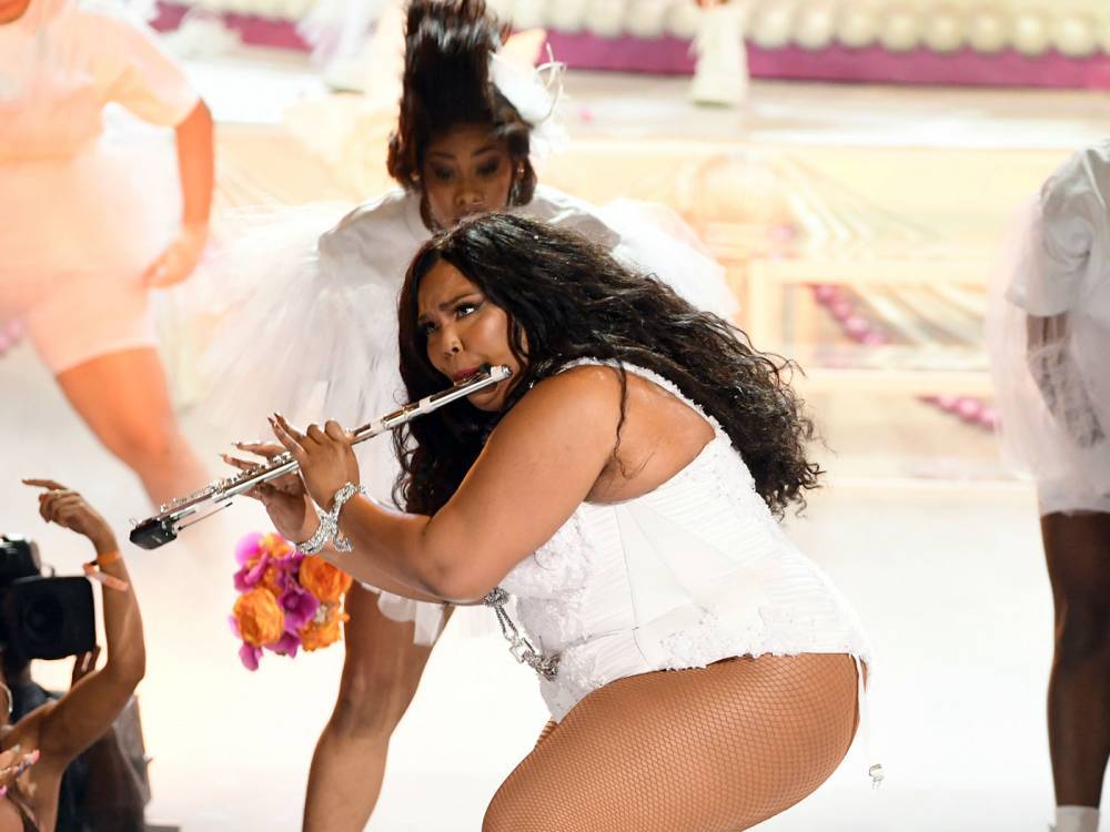 Lizzo calls out TikTok for removing swim suit videos - www.nme.com