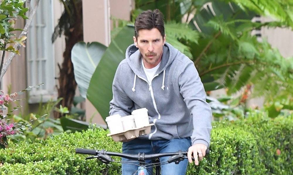 Christian Bale Balances a Tray of Coffee While Riding a Bike - www.justjared.com