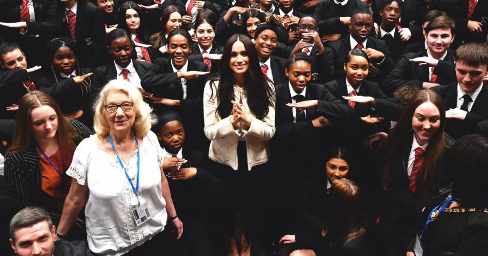 Meghan Markle Makes Surprise Solo Appearance at London School for International Women’s Day - www.usmagazine.com - Britain - London