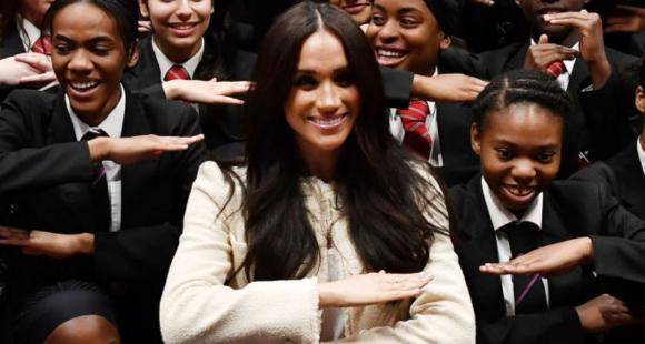 PHOTOS: Meghan Markle joins a group of students to make the equality sign on International Women's Day - www.pinkvilla.com - London