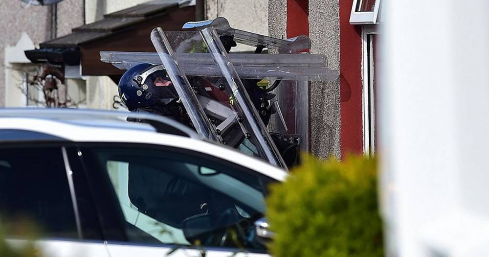 Mystery as riot cops surround Ayrshire house amid 'disturbance' - www.dailyrecord.co.uk - Scotland - city Irvine
