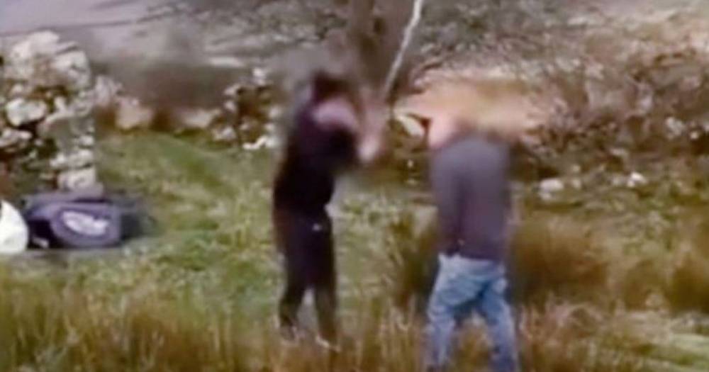 Shocking moment camper appears to threaten man with stick after being asked to leave North Wales beauty spot - www.manchestereveningnews.co.uk