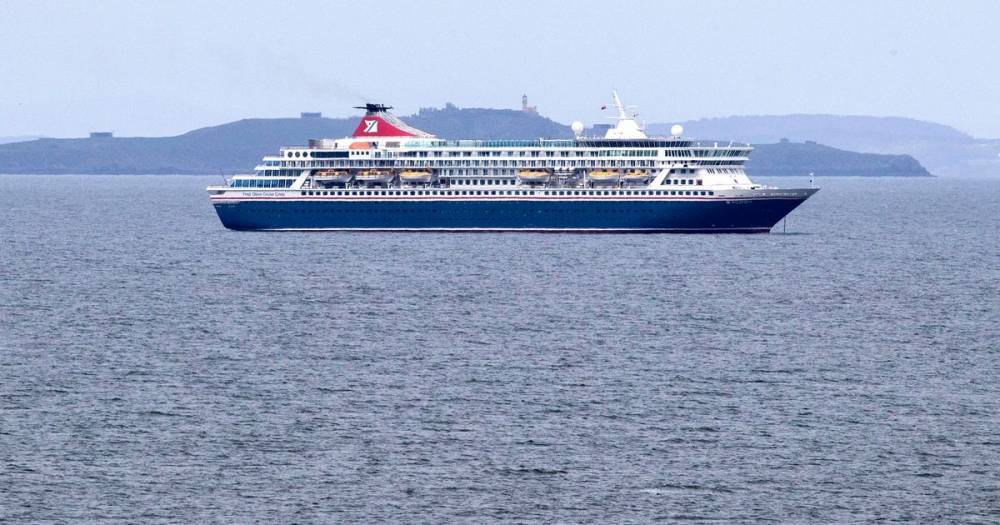 Eight people test positive for coronavirus on board cruise ship moored near Edinburgh - www.dailyrecord.co.uk