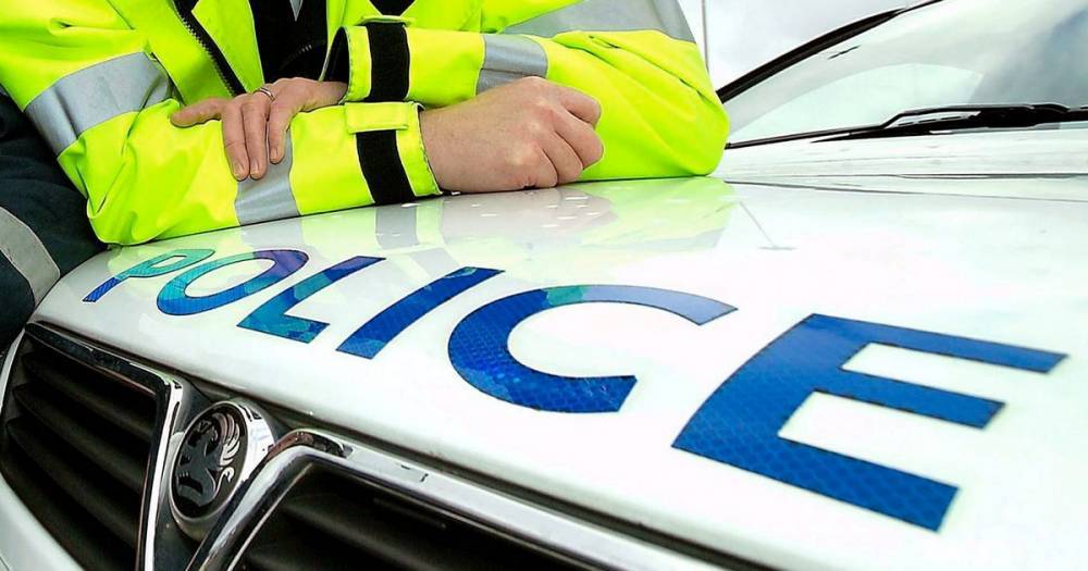 Man charged with assault after 'two police officers spat at by man claiming to have Covid-19' - www.manchestereveningnews.co.uk - Manchester