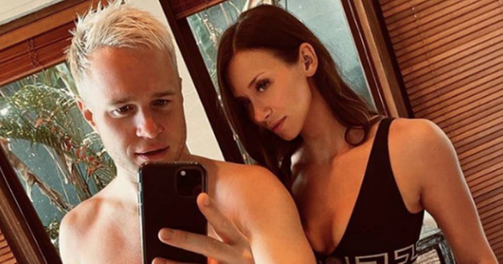 Olly Murs' girlfriend Amelia Tank shows off incredible strength by holding his entire bodyweight as he sips wine - www.ok.co.uk