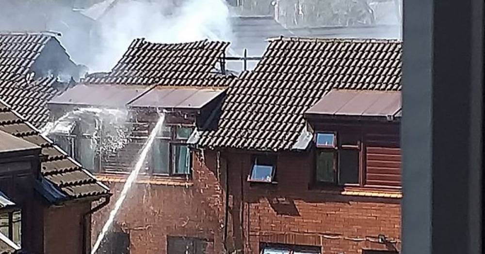 Residents evacuated in huge house fire as roof collapses...firefighters are still tackling the blaze - www.manchestereveningnews.co.uk - Manchester