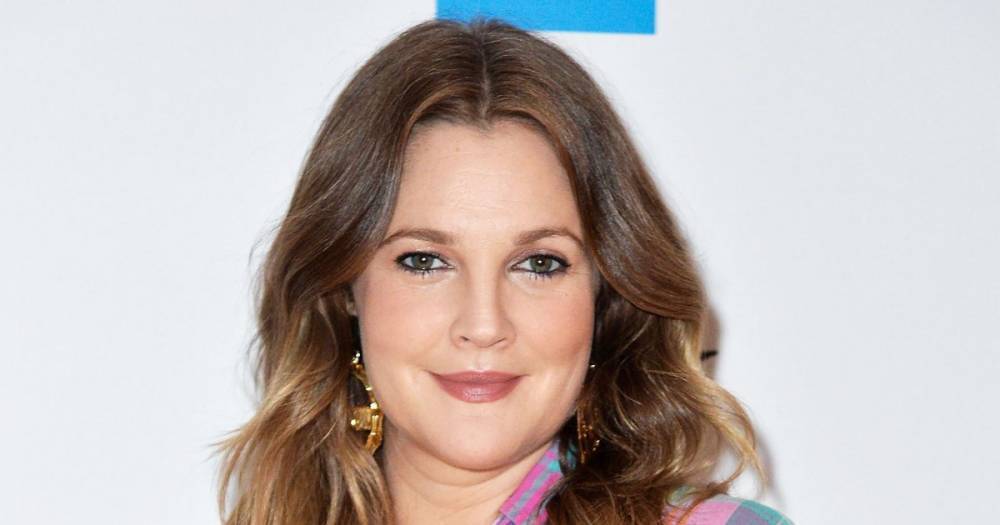 Drew Barrymore Went Up 3 Shoe Sizes After Giving Birth: ‘I’ve Had to Give Up My Old Shoe-Loving Carrie Bradshaw Days’ - www.usmagazine.com - Britain