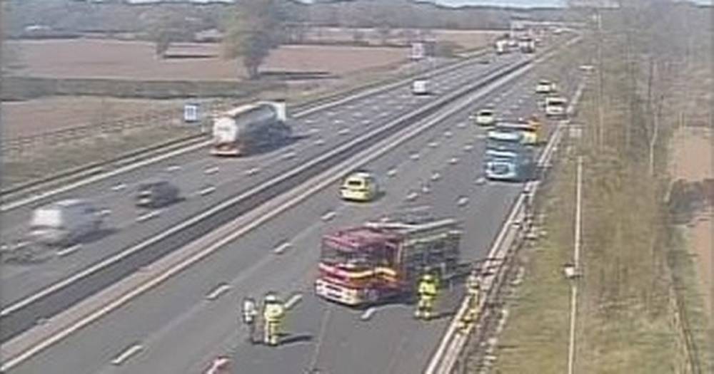 M6 closed with major traffic delays after lorry carrying pallets of salt crashes and sets alight - www.manchestereveningnews.co.uk