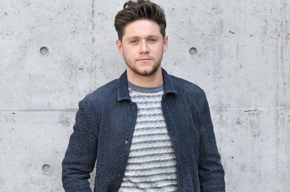 Niall Horan Reminisces on Touring for 'Black & White' Music Video - www.billboard.com