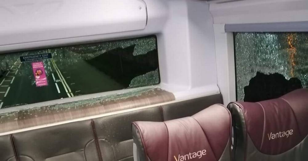 Bus windows smashed by 'mindless vandals' during late night attack - www.manchestereveningnews.co.uk - Manchester - county Lane