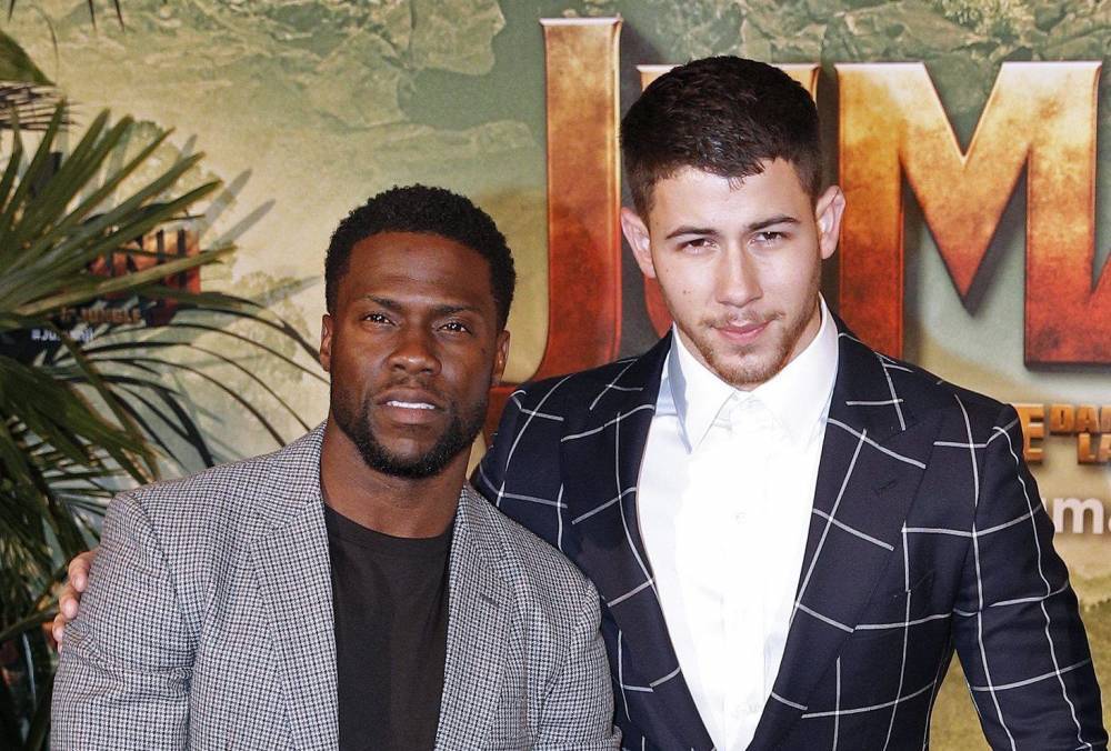 Watch Kevin Hart And Nick Jonas Run Off When Asked To Hold A Huge Snake - etcanada.com