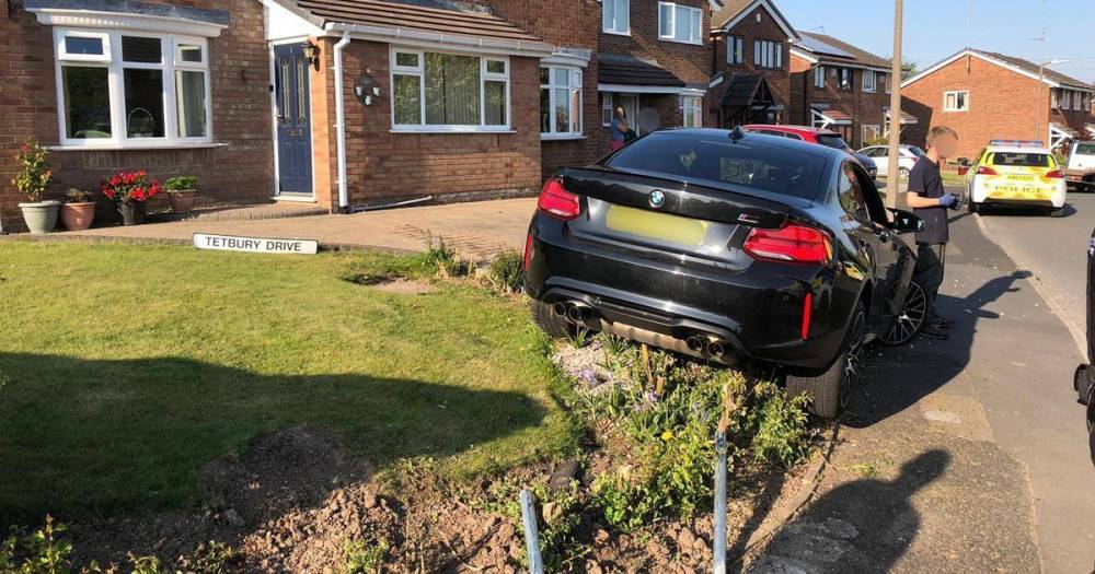 Drug driver arrested after smashing BMW into front garden - www.manchestereveningnews.co.uk - Manchester