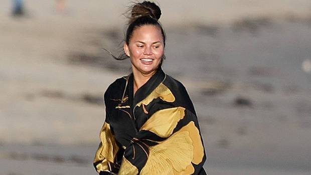 Chrissy Teigen Poses In Sexy Plunging Swimsuit Claps Back At Haters Mocking Her Body - hollywoodlife.com