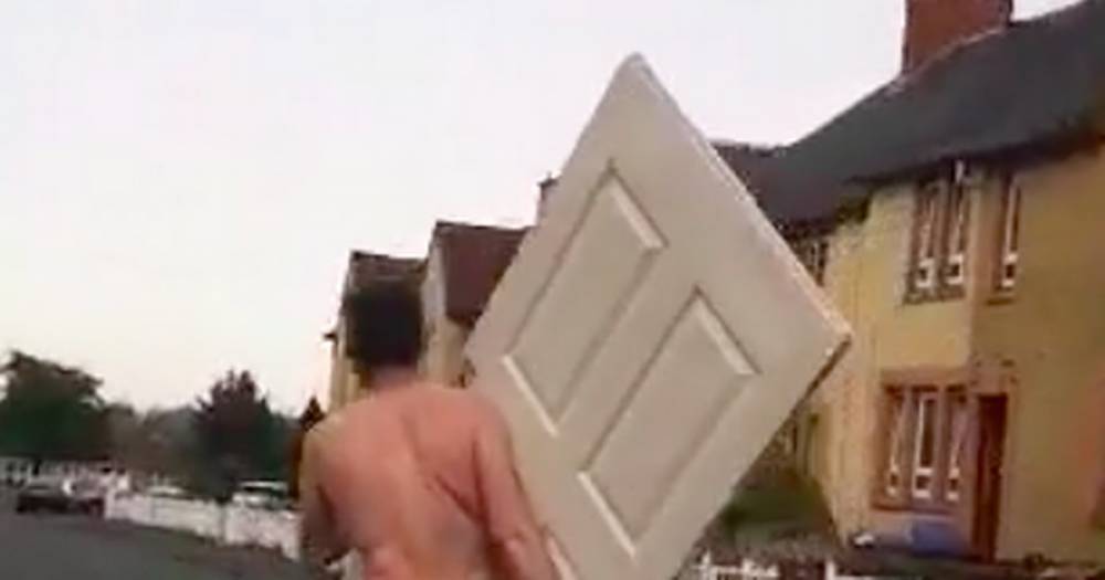 Scots driver baffled by bizarre lockdown scene as half-naked man staggers down street carrying a door - www.dailyrecord.co.uk - Scotland