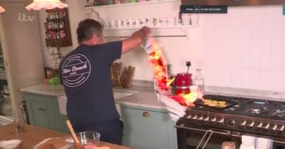 This Morning’s Holly and Phillip scream as John Torode's tea towel catches on fire during cooking segment - www.ok.co.uk