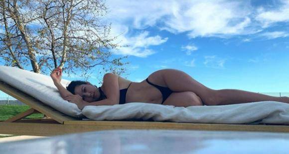 Kourtney Kardashian flaunts her curves in black bikini as she soaks up the sun by poolside; See Photos - www.pinkvilla.com - California