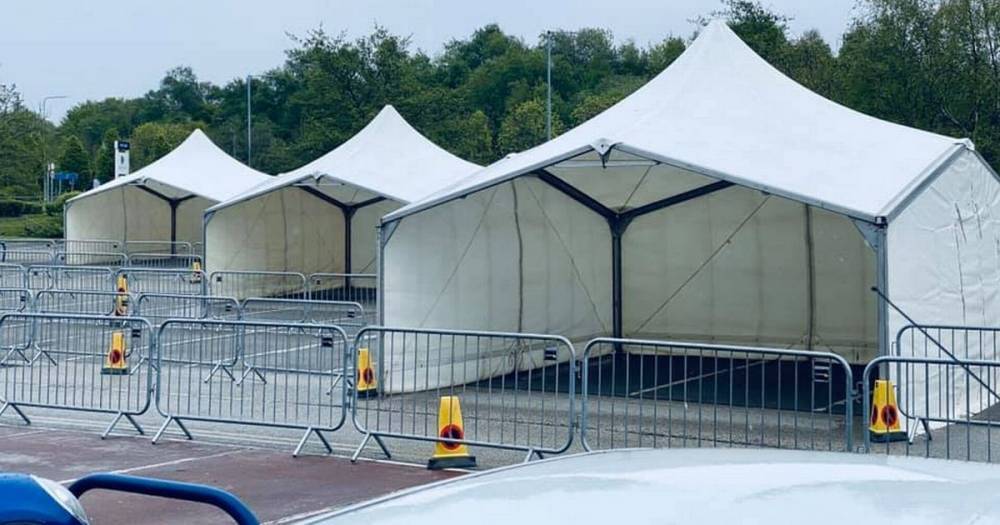 Coronavirus drive-by testing tents put up outside the University of Bolton Stadium - www.manchestereveningnews.co.uk