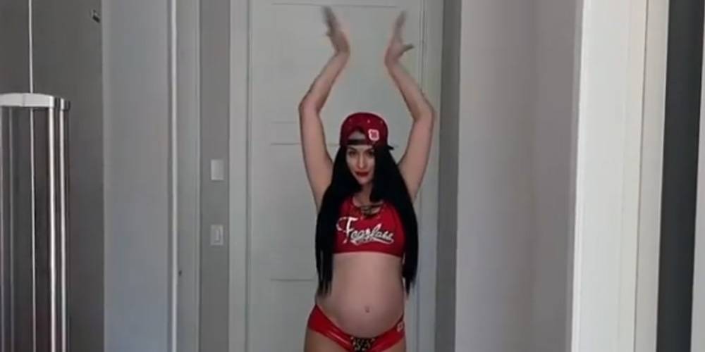 Pregnant Nikki Bella Shows Off Her Baby Bump in WWE Uniform! - www.justjared.com