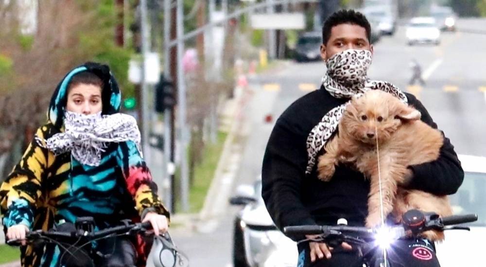 Usher Carries His Dog on Bike Ride with Girlfriend Jennifer Goicoechea - www.justjared.com