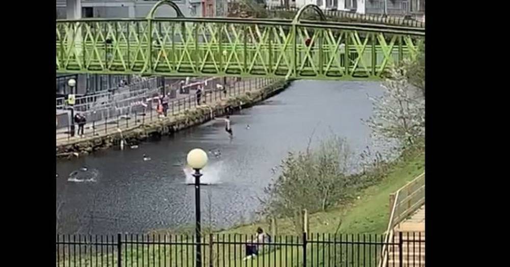 Two young men ignore coronavirus lockdown and leap into River Irwell from bridge - www.manchestereveningnews.co.uk - Manchester