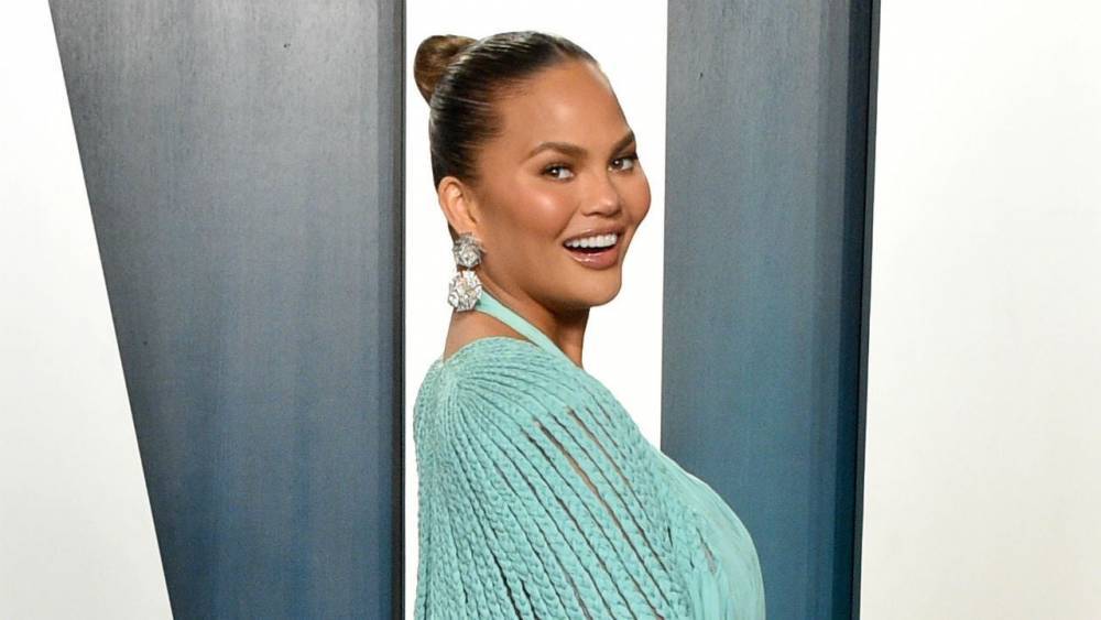Chrissy Teigen Shares ‘Thirst Trap’ Swimsuit Photo of Herself and Her New Dog Petey - www.etonline.com