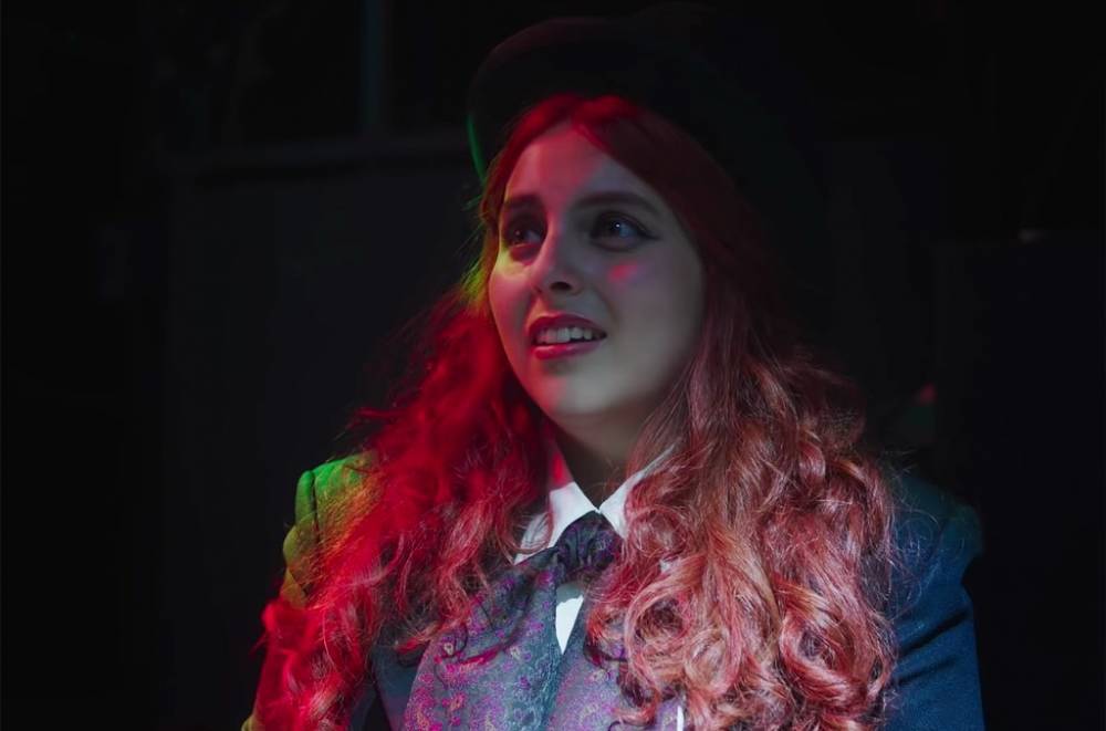 Beanie Feldstein Creates Rebellious Music Critic Persona in 'How to Build a Girl' Trailer - www.billboard.com