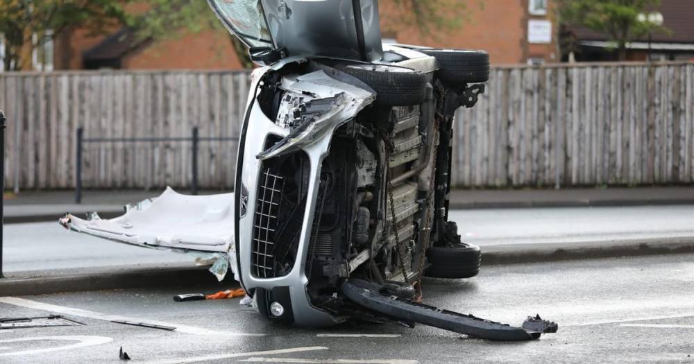 Woman and teenage girl taken to hospital after car 'hits barrier' and flips onto side - www.manchestereveningnews.co.uk - Manchester