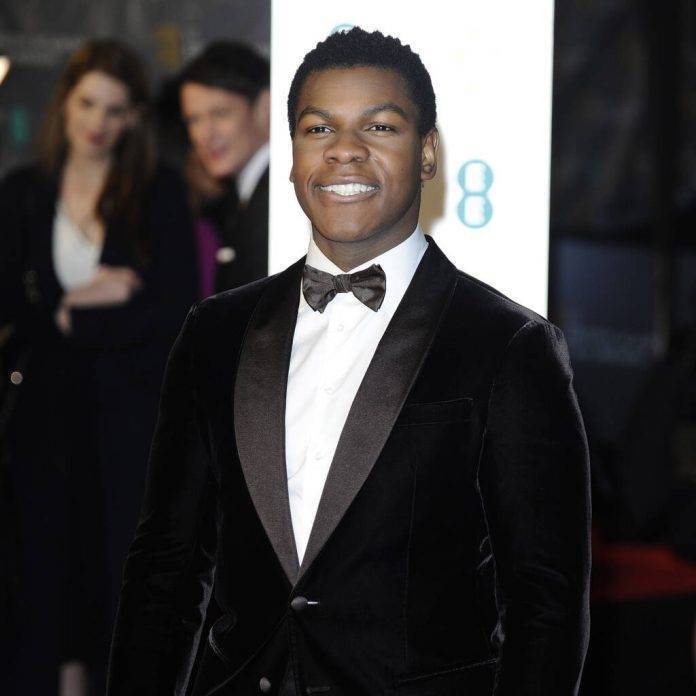 John Boyega in trouble with his mum over secret chest tattoo - www.peoplemagazine.co.za