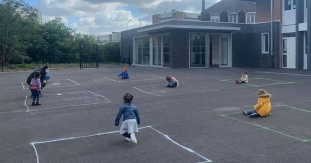 Heartbreaking photo of French children 'playing' in isolated chalk squares shows reality of schools reopening - www.manchestereveningnews.co.uk - France - Belgium