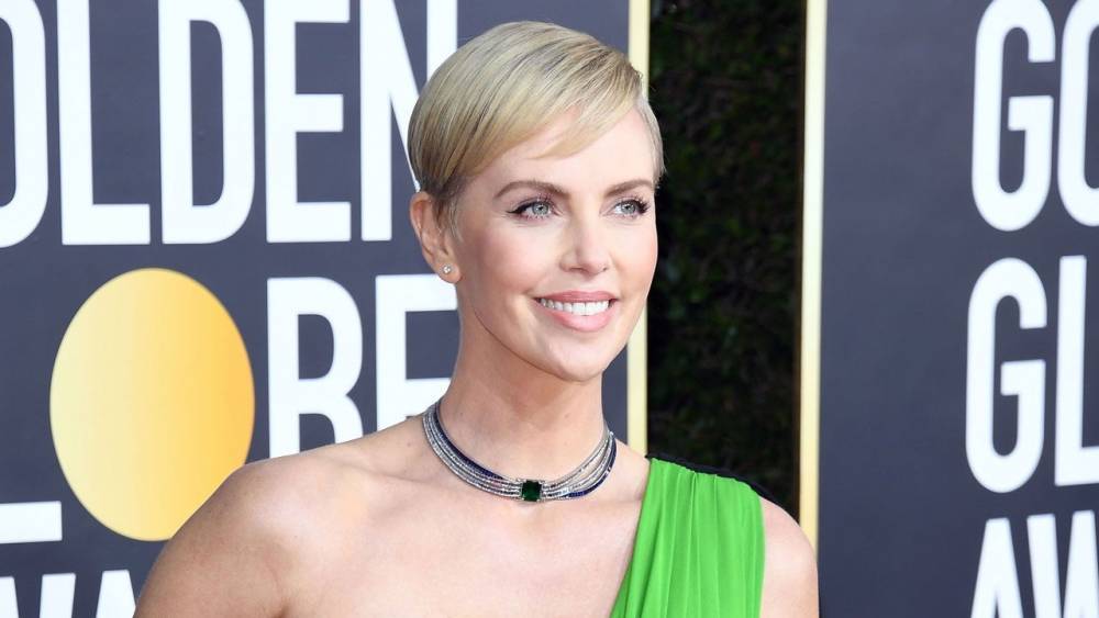 Charlize Theron Shares Rare Photo of Herself With Daughter Jackson on the Set of ‘Mad Max’ - www.etonline.com