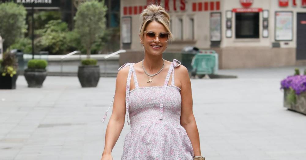 Vogue Williams proudly shows off her blossoming baby bump as she steps out in a stunning summer dress - www.ok.co.uk