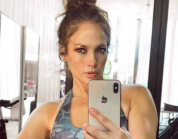 Mystery Solved: Here's Who Is Behind Jennifer Lopez In That Eyebrow-Raising Selfie - www.eonline.com