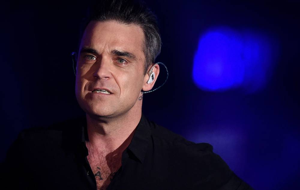 Robbie Williams reveals his father has been diagnosed with Parkinson’s disease - www.nme.com - Britain - Los Angeles