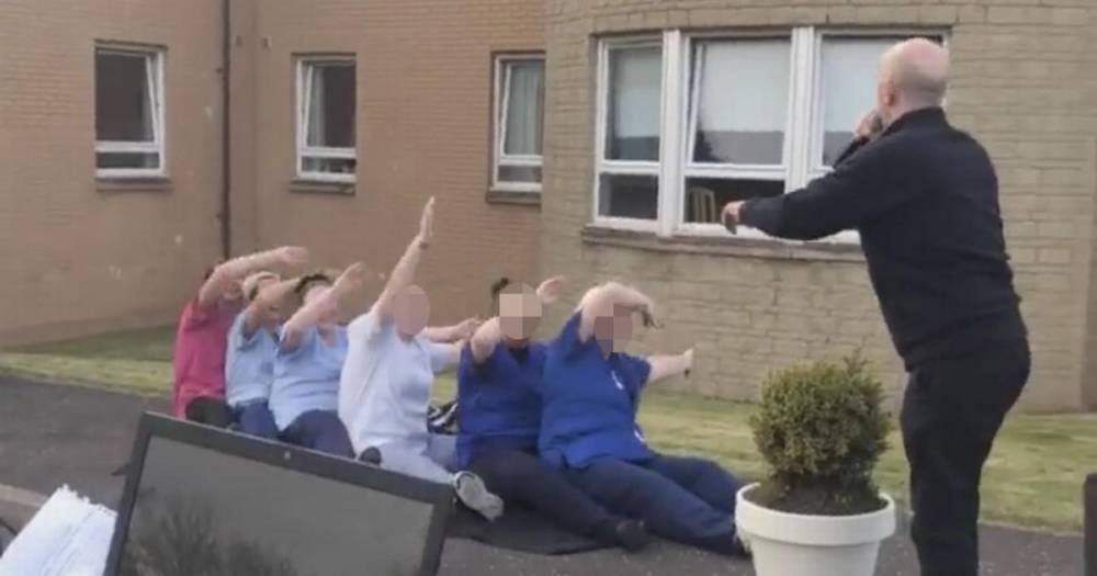 Care home workers ignore social distancing rules during car park dance and sing along with DJ - www.dailyrecord.co.uk