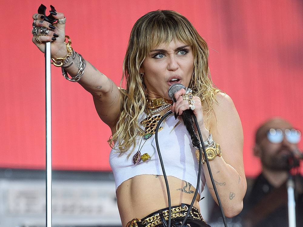Miley Cyrus puts boyfriend in Vivienne Westwood dress for directorial debut - torontosun.com - Australia