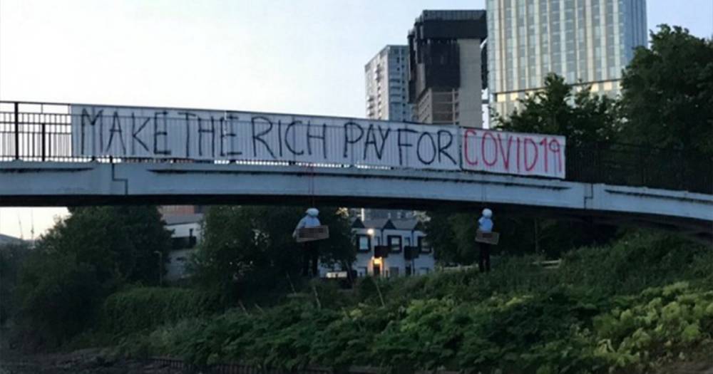 Effigies of government figure and businessman hung on Salford bridge below coronavirus protest banner slammed as ‘unacceptable’ - www.manchestereveningnews.co.uk