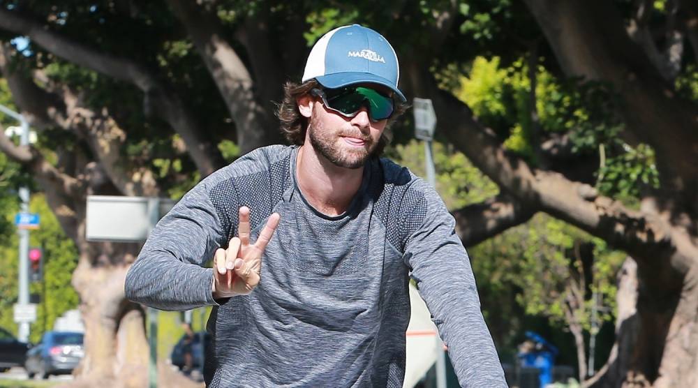 Patrick Schwarzenegger Throws Up the Peace Sign on Bike Ride - www.justjared.com