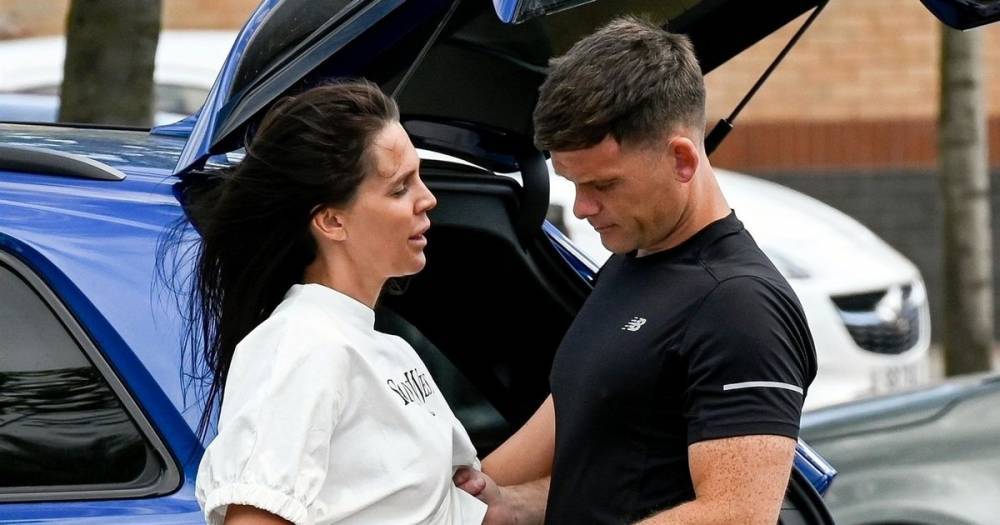 Danielle Lloyd's husband Michael O'Neill lovingly cradles her stomach as they pack on the PDA - www.ok.co.uk - Birmingham