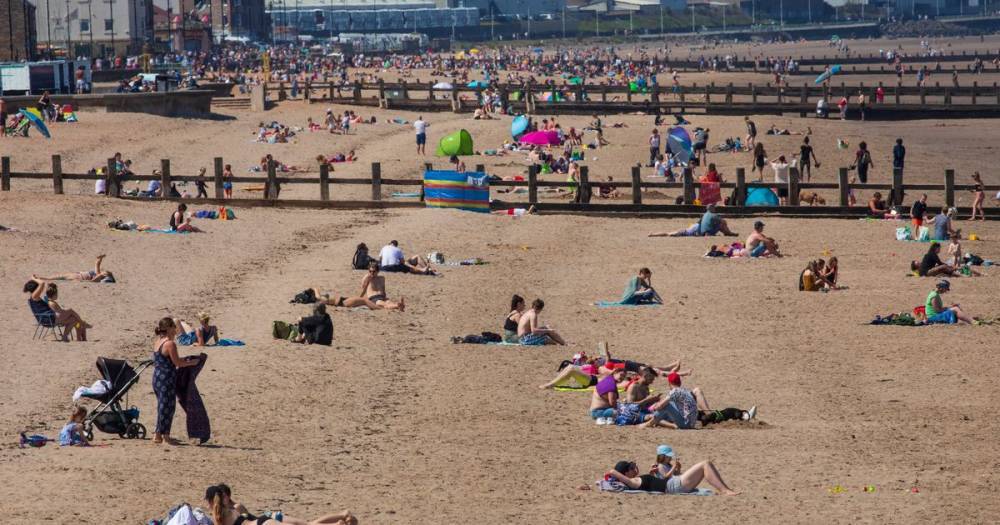 Hundreds of sunseeking Scots flock to Portobello beach as lockdown eases - www.dailyrecord.co.uk - Scotland - county Highlands