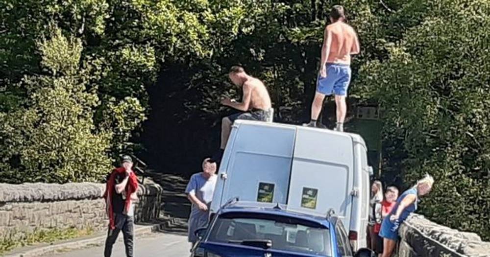 Shocking images show youths ignoring social distancing advice and jumping into reservoirs - www.manchestereveningnews.co.uk - Indiana - Lake