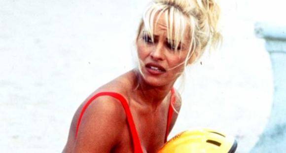 Pamela Anderson still owns her Baywatch red swimsuit; Says 'It still fits' - www.pinkvilla.com