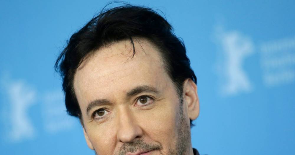 John Cusack live-tweets Chicago protest, gets 'hit by pepper spray' - www.wonderwall.com - Chicago - city Windy
