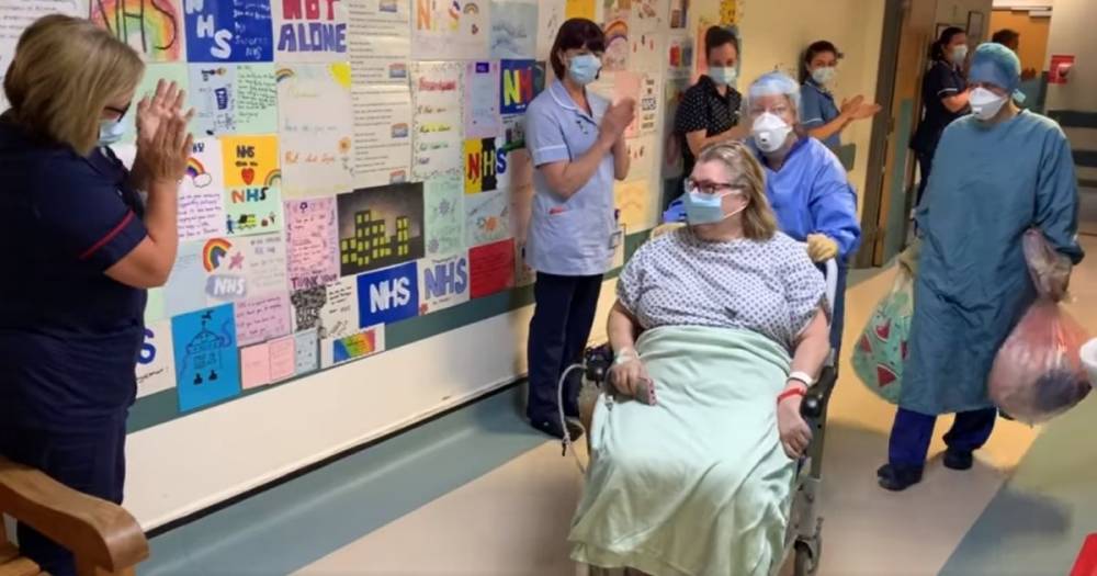 Touching moment ward clerk in recovery from coronavirus is applauded by 'overjoyed' colleagues as she leaves the critical care unit - www.manchestereveningnews.co.uk