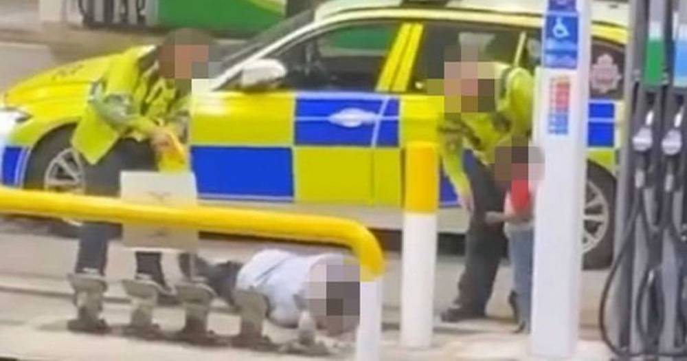 Boy cries out 'daddy' as police Taser his father in front of him in shock video footage - www.dailyrecord.co.uk - Manchester