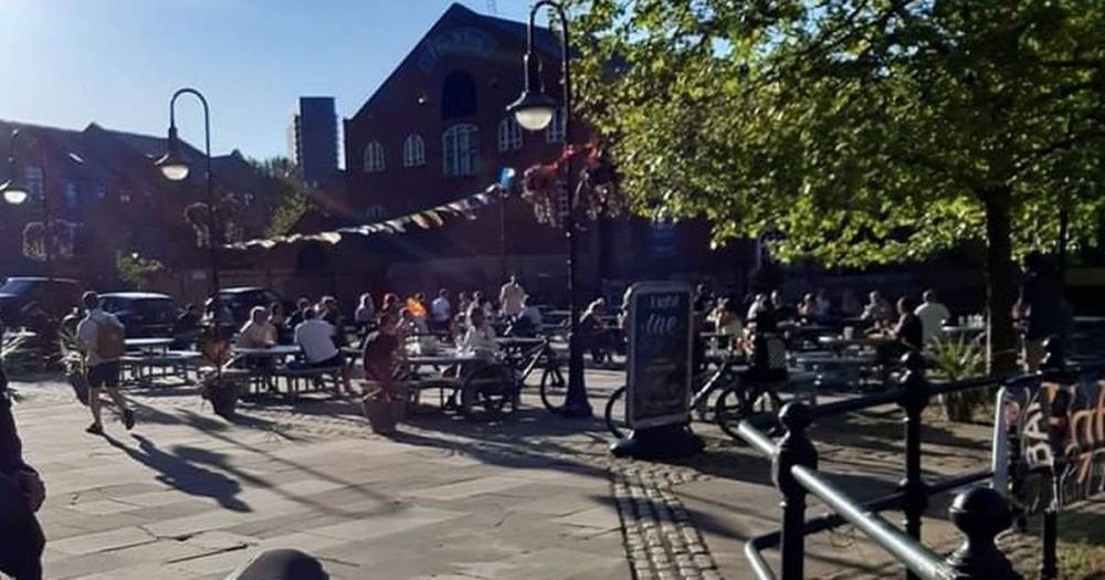 Bar denies breaking lockdown rules after picture shows dozens congregating outside - www.manchestereveningnews.co.uk - Manchester