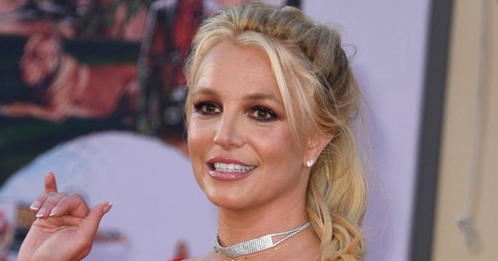 Britney Spears writhes around in a bikini and chains for saucy new album cover - www.dailyrecord.co.uk