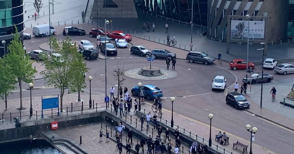 New footage shows around 30 cars abandoned by people taking part in a champagne gathering at Salford Quays - www.manchestereveningnews.co.uk - city Media