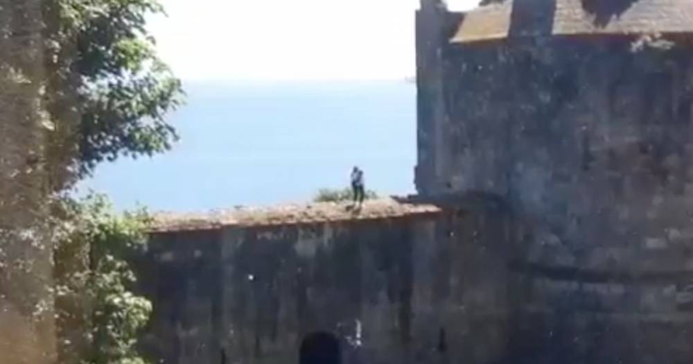 Young girls risk death shooting TikTok video on Scots castle ruins above 60ft drop - www.dailyrecord.co.uk - Scotland