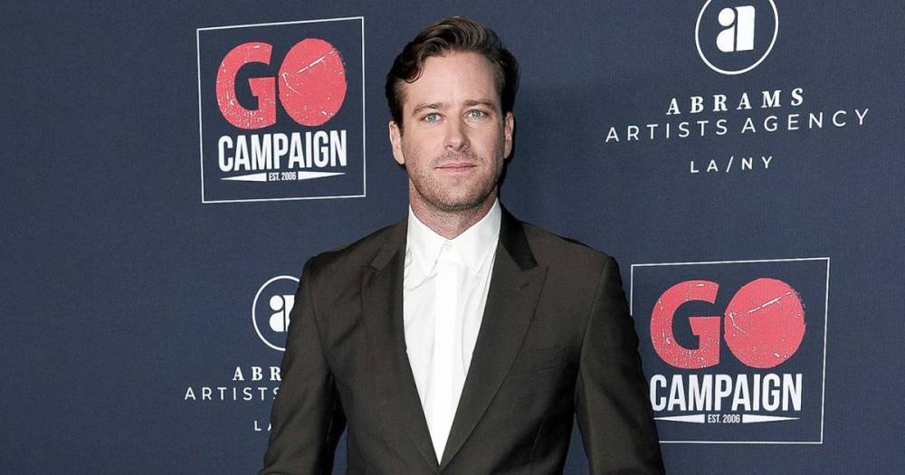 Armie Hammer Shares Video of Himself Chugging a Beer, Golfing: ‘The World Is Ending’ - www.usmagazine.com - Britain - California - Cayman Islands
