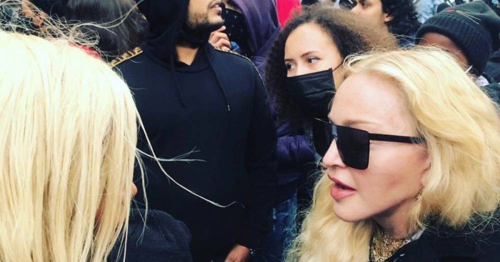 Madonna praised by fans as she’s spotted marching in crutches at Black Lives Matter protest in London - www.ok.co.uk - London